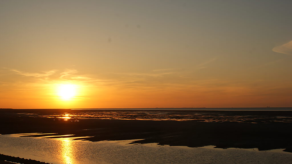 Ondergaande zon Waddenzee